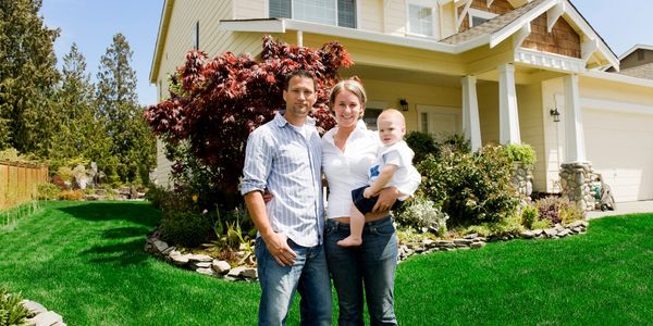 family in front of there home