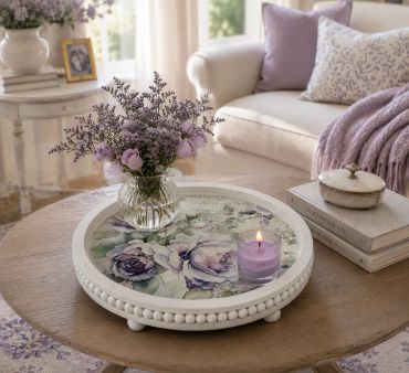 Cozy living room with floral decor and a lit candle.