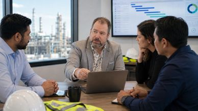 Business meeting discussing data in an office.