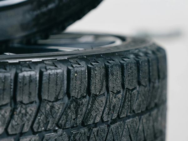 Close-up of a textured car tire tread.