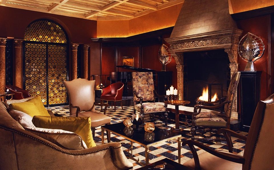 Luxurious living room with fireplace and elegant decor.