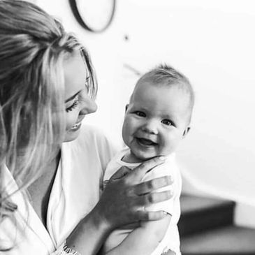 Mum and baby smiling