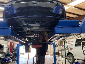Alex performing an oil change on a 2019 Chevrolet Camaro SS with a 6.2L V8