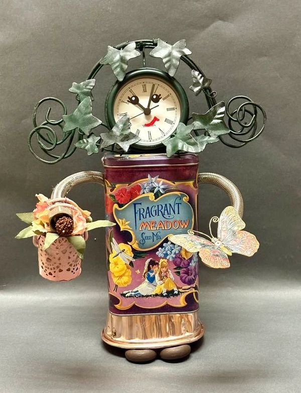 Decorative clock with floral and butterfly designs in a vintage style.