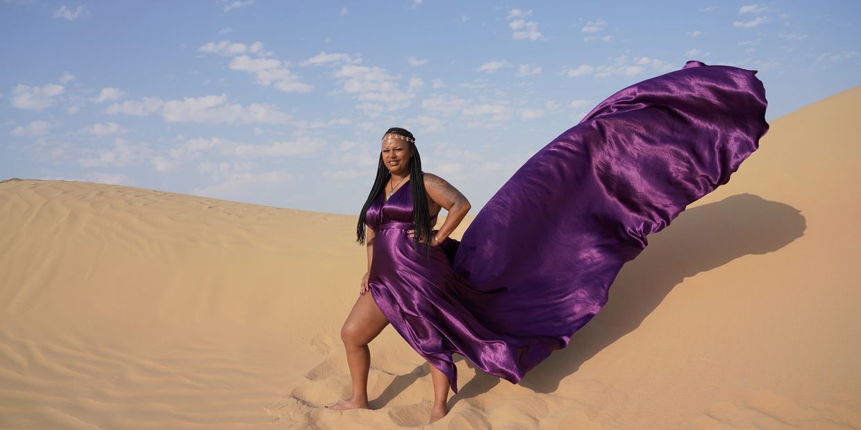 Standing in Dubai’s shimmering dunes, 