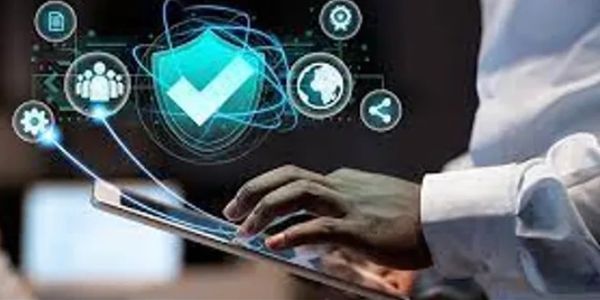 Person using a tablet with digital security icons floating above.