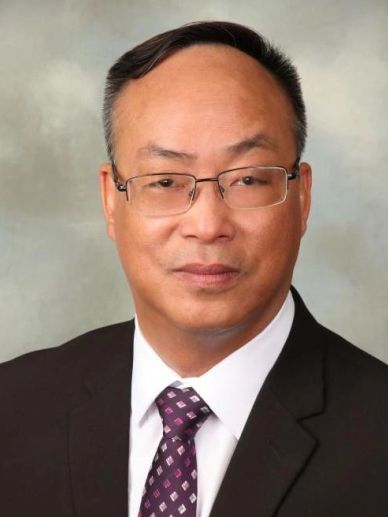 Professional man in suit with glasses.