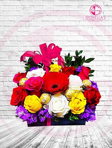 Beautiful  flower mix arrangement with roses, stock and green mix with chocolates