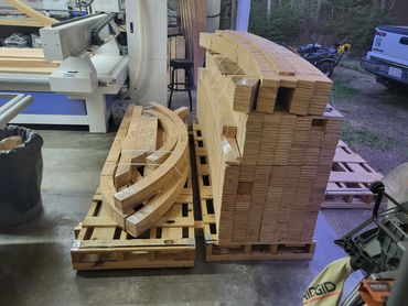 Radiused strips of plywood 3.5" wide and doubled up to get a standard 2" x 4"  thickness.