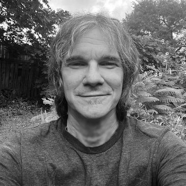Black and white close-up selfie of David Loren from the band Blue Cartoon.  