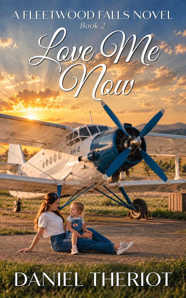 Woman and child sitting together near an airplane at sunset.