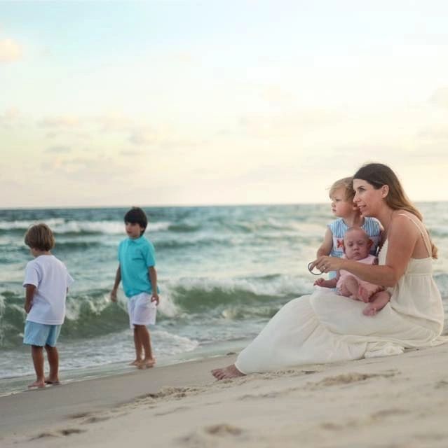 DONA-certified doula Mary with her four children, enjoying quality family time at the beach.