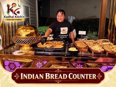 Indian bread counter with an attendant serving flatbreads.