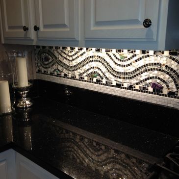 A Mosaic Pattern in Brown Shades in Kitchen Back Splash