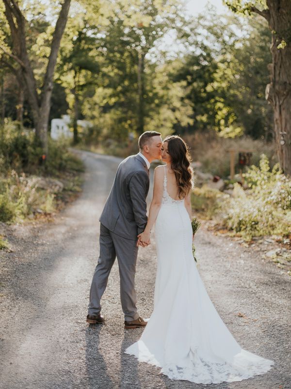 Wedding portrait of bride and groom at backyard wedding in Prince Edward County, Ontario