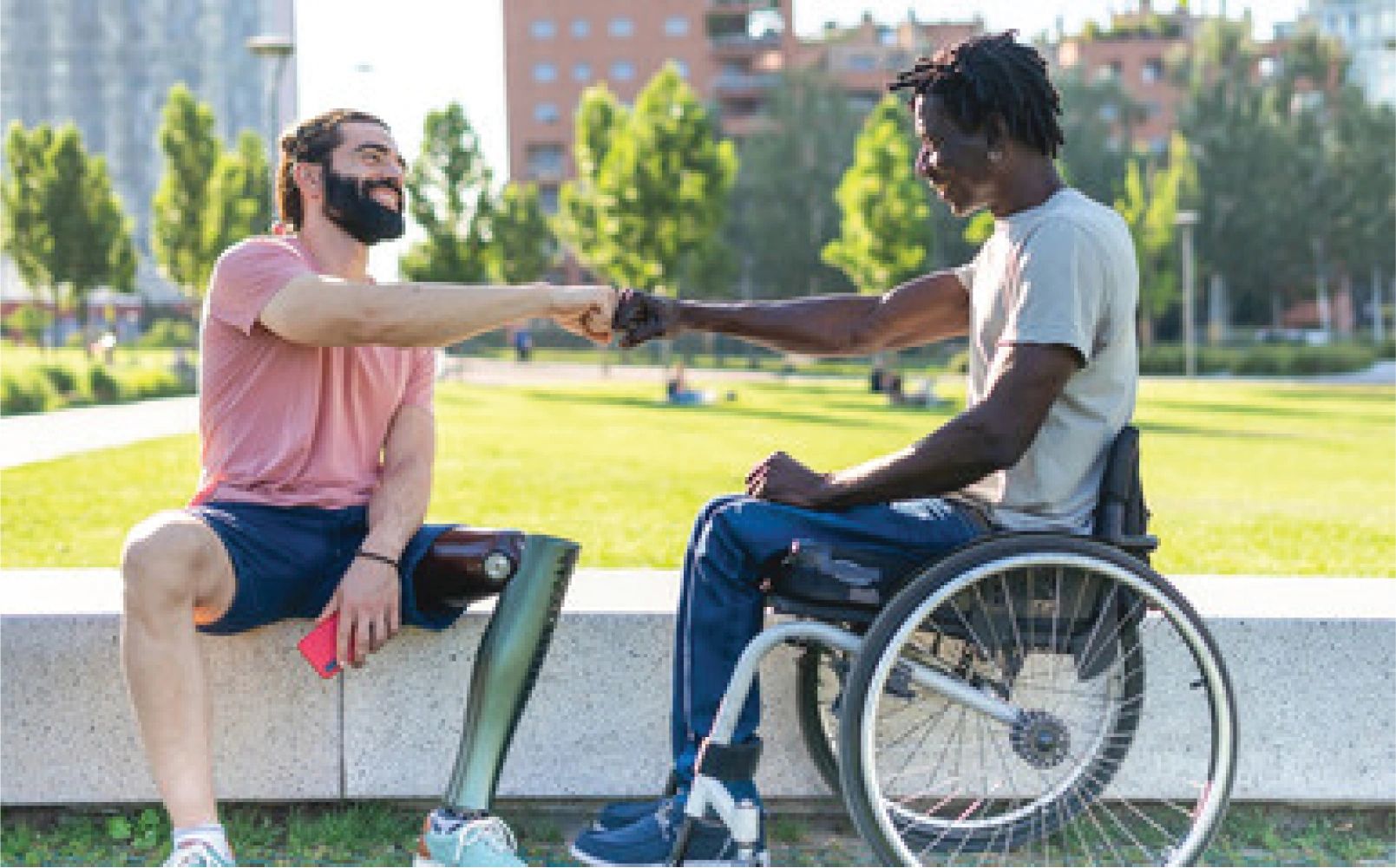 Disabled gentlemen fist bumping
