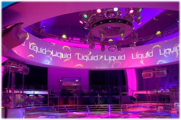 Futuristic club with dynamic LED lighting and vibrant colors.