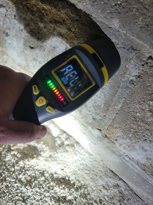 The efflorescence gave it away but the moisture reading said it all for this underground wall.