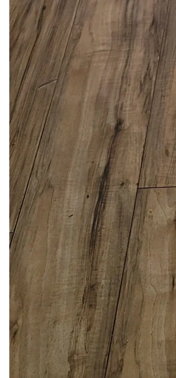 The bubbling in the floor suggests there was a water leak.  Later found out this was not disclosed.