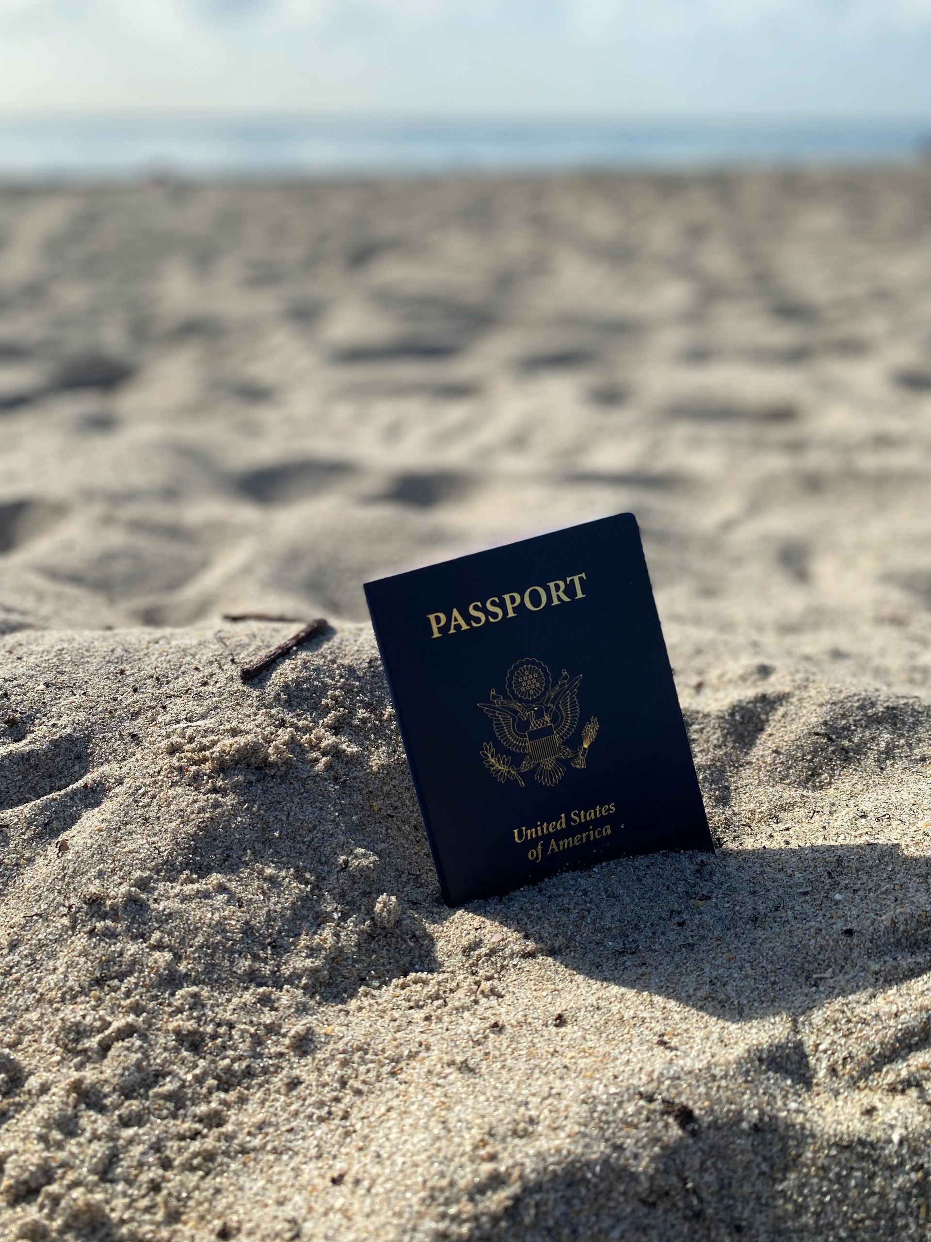 Passport in sand