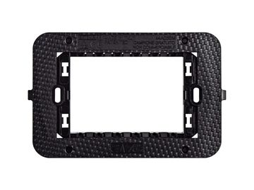 Black rectangular mounting bracket with textured surface and multiple slots.