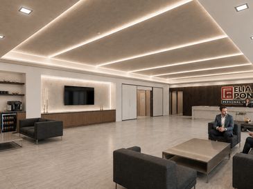 Modern office lobby with sleek furniture and illuminated ceiling design.