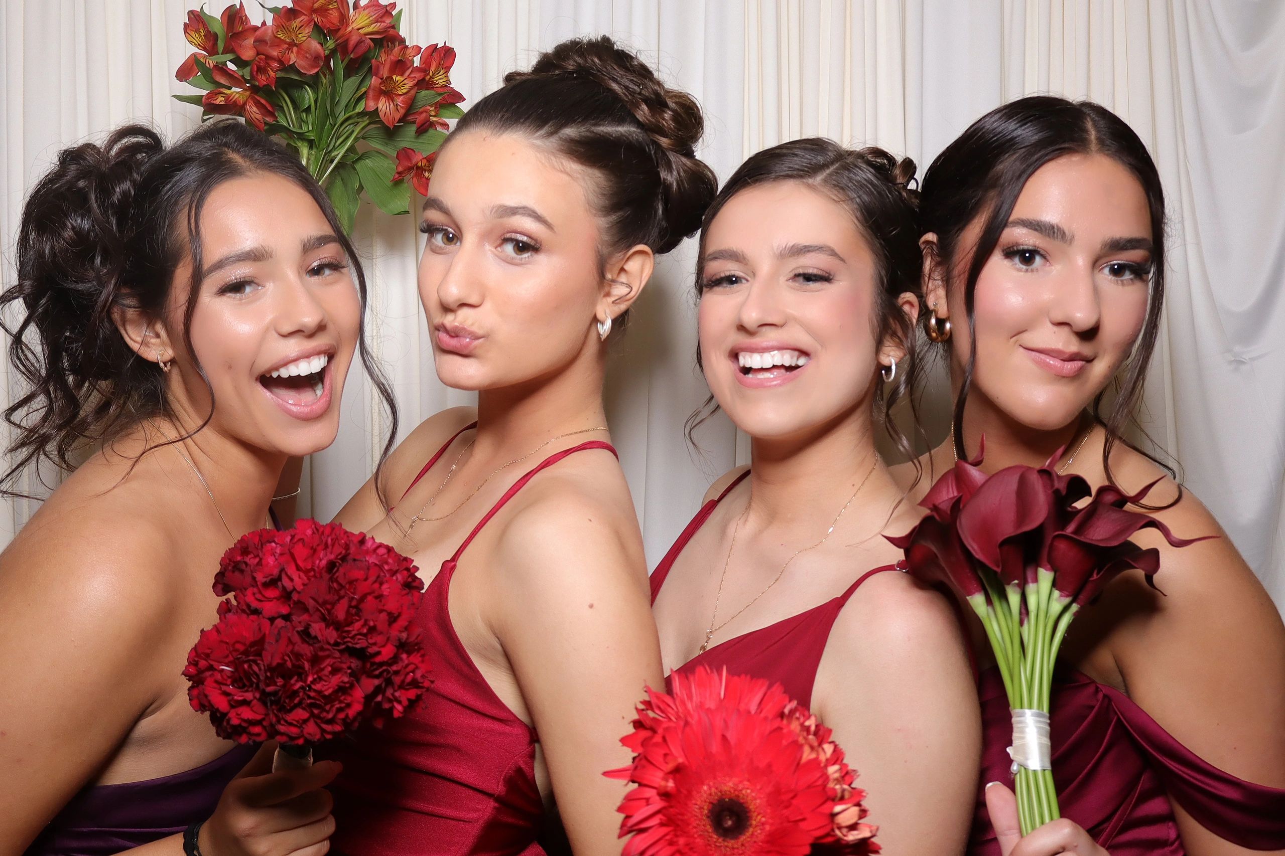 Bridesmaid posing for a photo at a photobooth