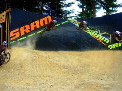 PC Jake Garrett. Me at 16 riding a wall ride with a gap on/off at Crankworx Festival Whistler BC.