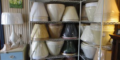Shelves filled with various lamp shades.