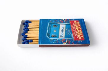 A blue matchbox with blue-tipped matches.
