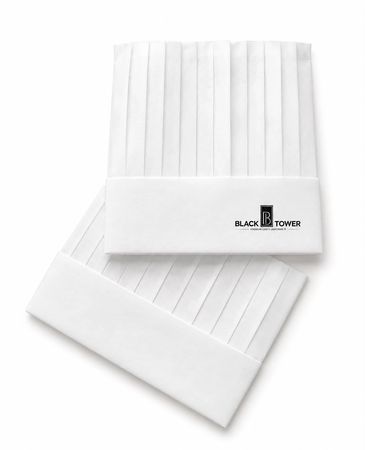 White pleated chef hats with Black Tower logo.