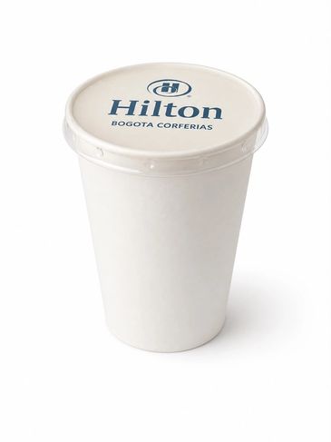 White disposable cup with Hilton Bogota Corferias logo on lid.