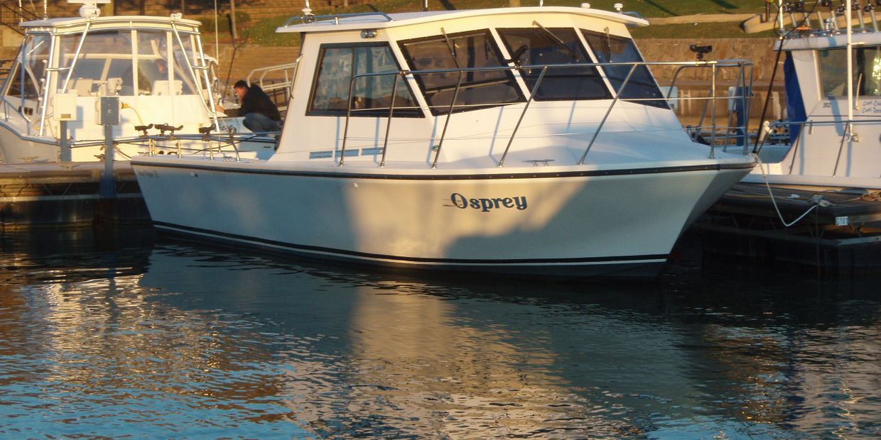 The Osprey Island Hopper fishing charter boat docked in Port Clinton, Ohio.