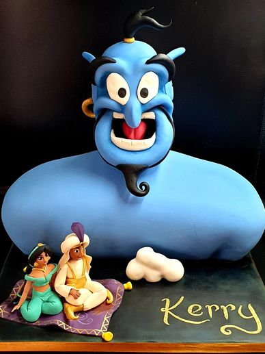 Disney aladdin and jasmine on carpet wih genie behind them 
