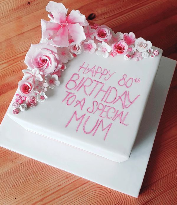 square pink and white floral cake