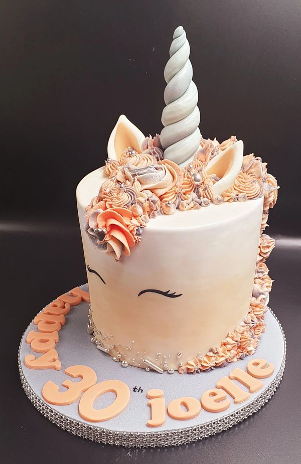 grey and peach unicorn cake