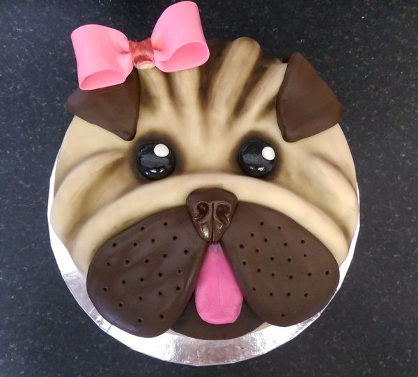 pug cake with a pink bow