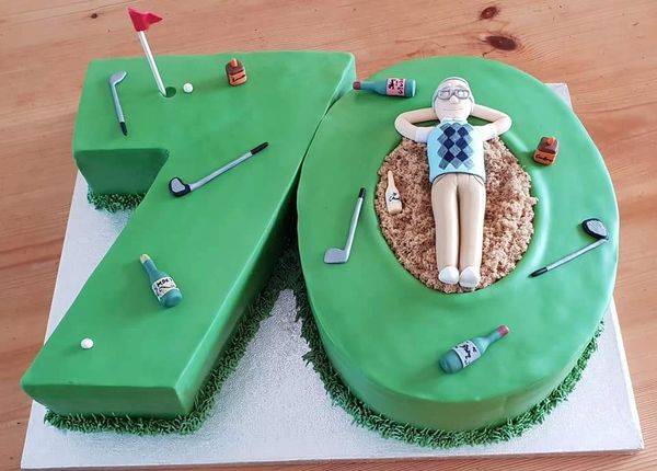 number 70 cake in a golfing theme