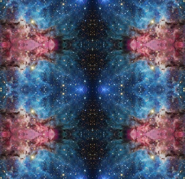 Symmetrical cosmic nebula pattern with vibrant blues and pinks.