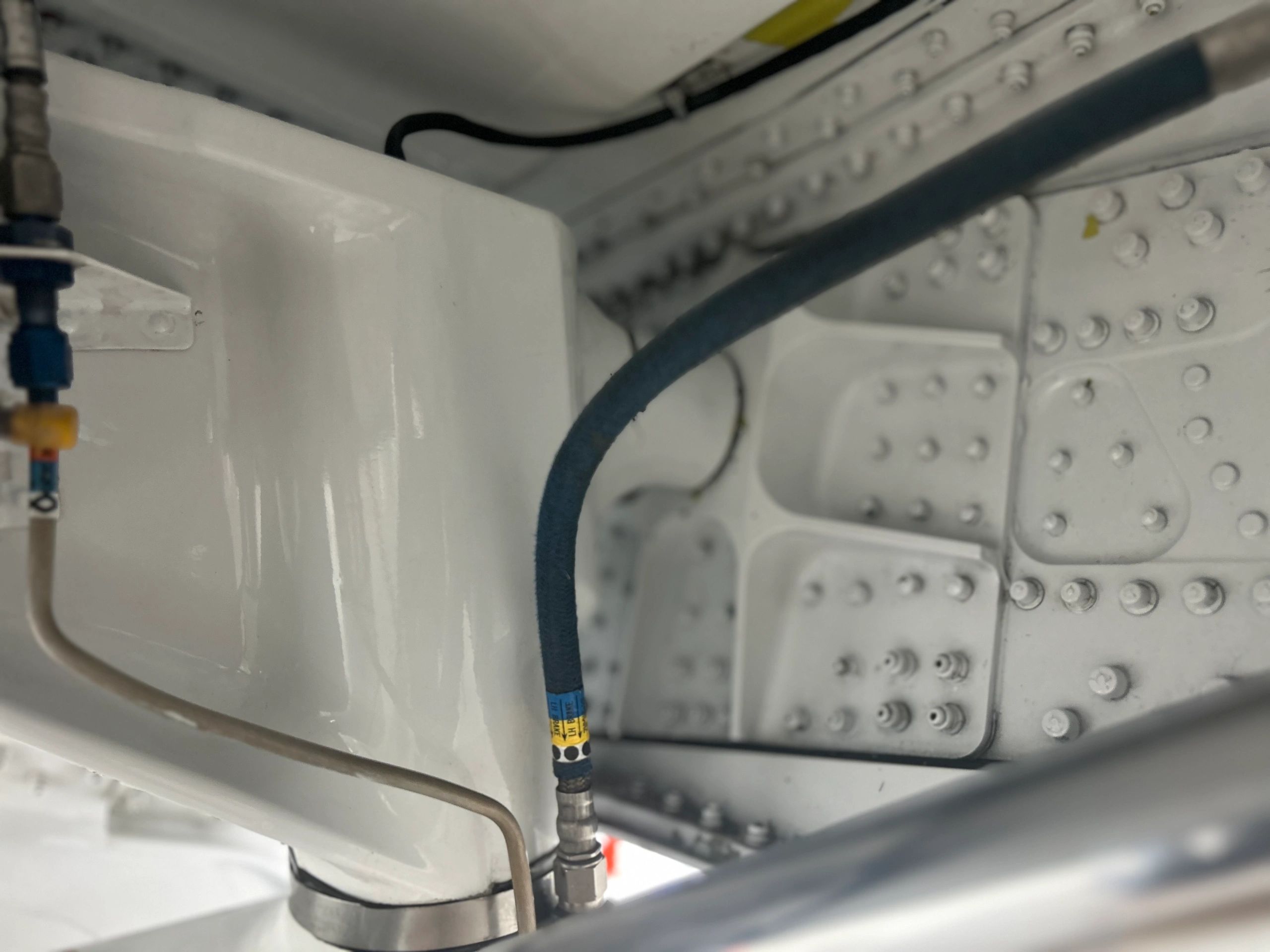 Close-up of aircraft landing gear components.