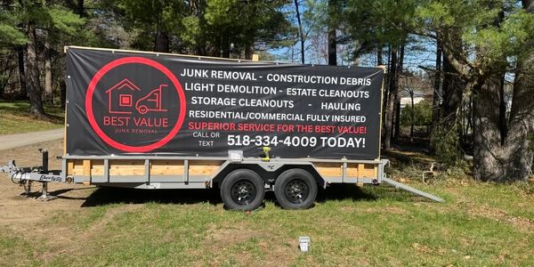 Trailer with logo 16ft legend with 6ft sides 25 cubic yards trees junk removal cleanout services