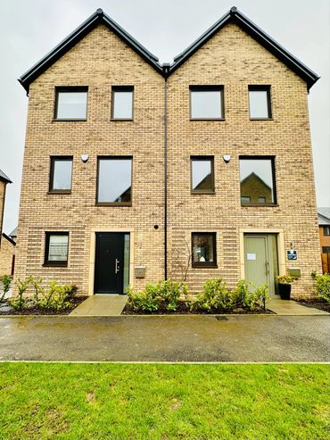 A pair of  semi-detached three storey brick houses
