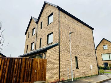 A pair of  semi-detached three storey brick houses