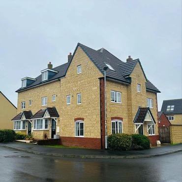 Beckstone and red brick block terrace of houses