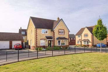 New build house completed by the team in stone with brick detailing.