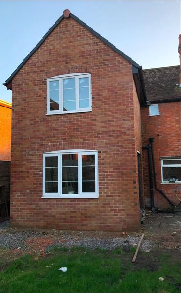 Red brick two storey extension in progress