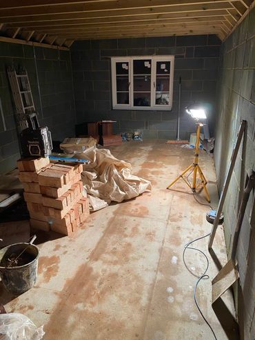 Interior of upper floor in two storey extension. Block work in background.