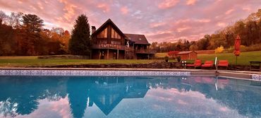 Luxury Catskills wedding venue with chalet log home, heated pool, spa and sunset mountain views