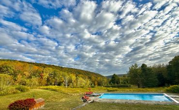 Panoramic pool, pond and mountain views at a Catskills destination wedding venue near Hancock NY