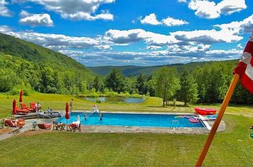 Private pool, pond, and mountain scenery at a Catskills wedding weekend venue near Callicoon NY.